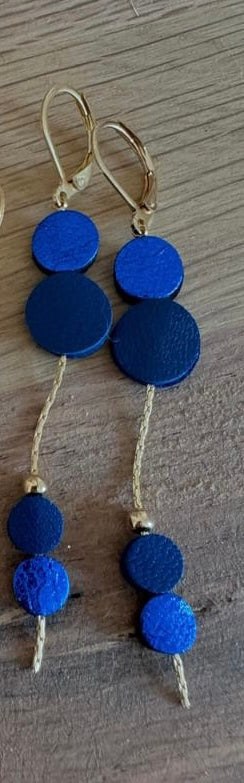 boucles d'oreilles de créatrice en cuir et acier