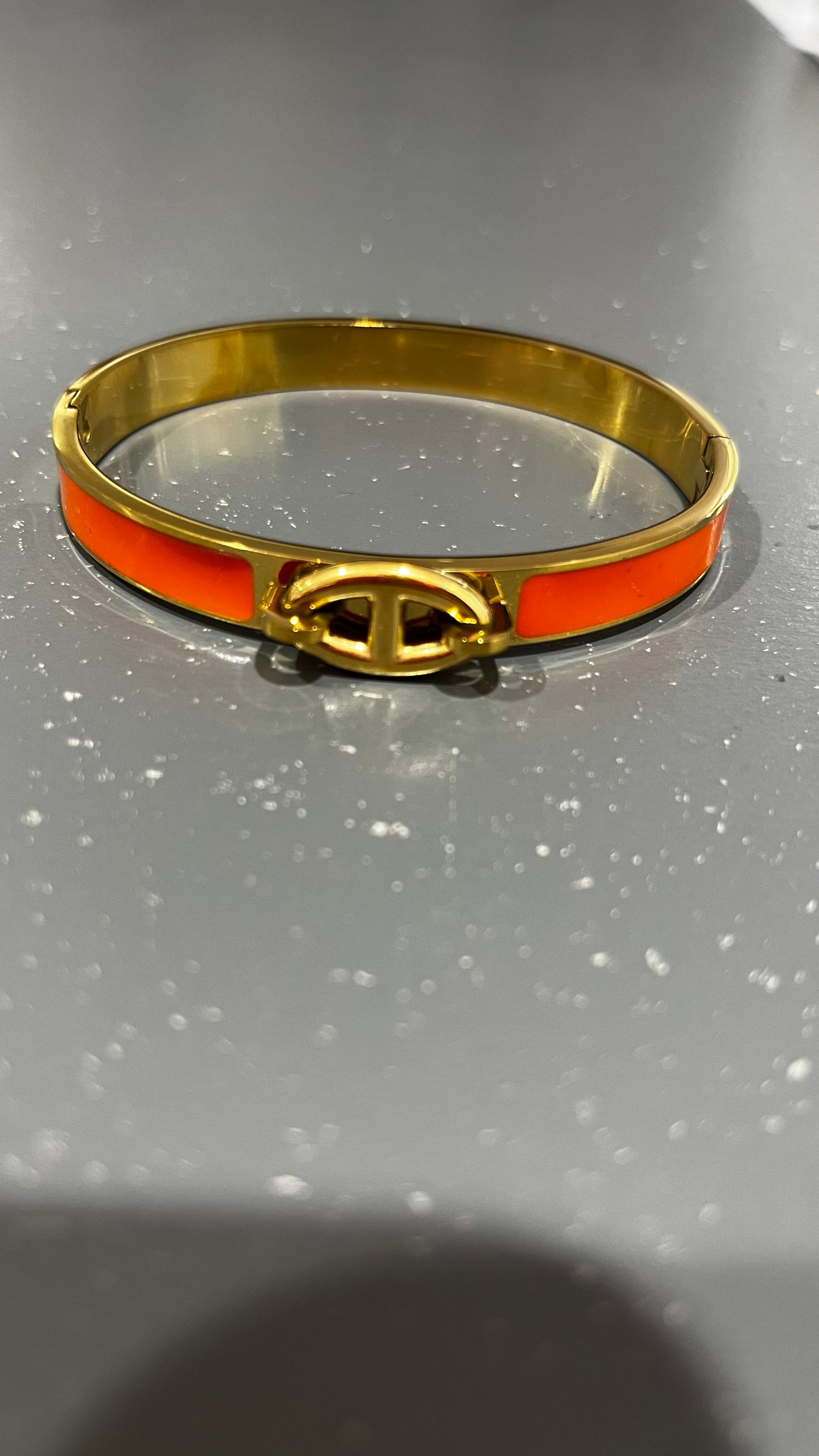 bracelet orange et doré en acier
