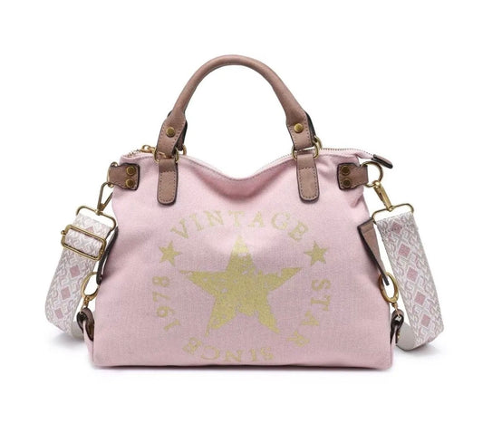 Sac à main rose poudré vintage avec étoile dorée et bandoulière imprimée, modèle féminin chic